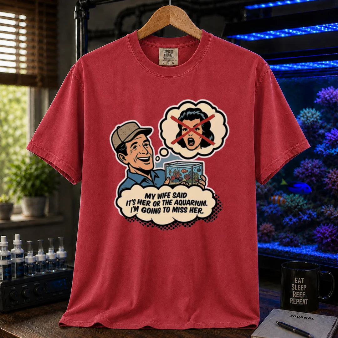 Saltwater aquarium graphic t-shirt featuring a retro comic illustration and text: MY WIFE SAID IT'S HER OR THE AQUARIUM. I'M GOING TO MISS HER., red crew neck tee