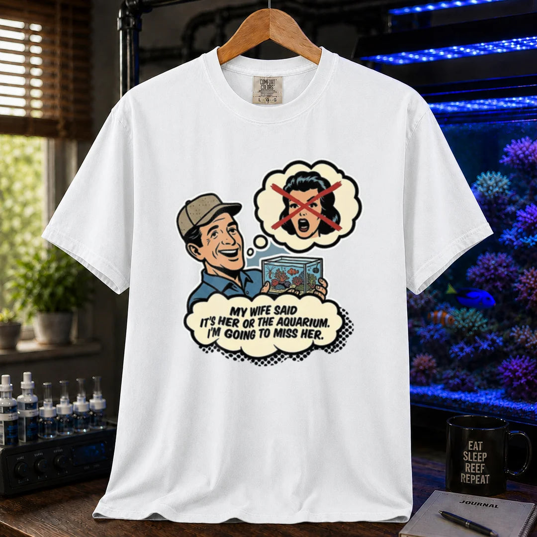 Saltwater aquarium graphic t-shirt featuring a retro comic illustration and text: MY WIFE SAID IT'S HER OR THE AQUARIUM. I'M GOING TO MISS HER., white crew neck tee