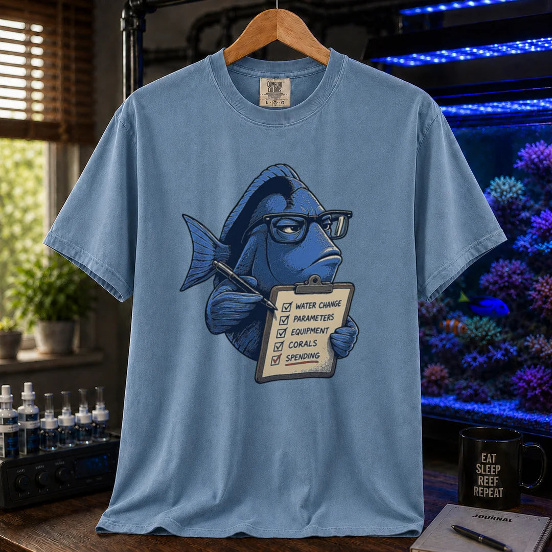 Saltwater aquarium graphic t-shirt featuring a blue tang with glasses holding a maintenance clipboard, blue crew neck tee