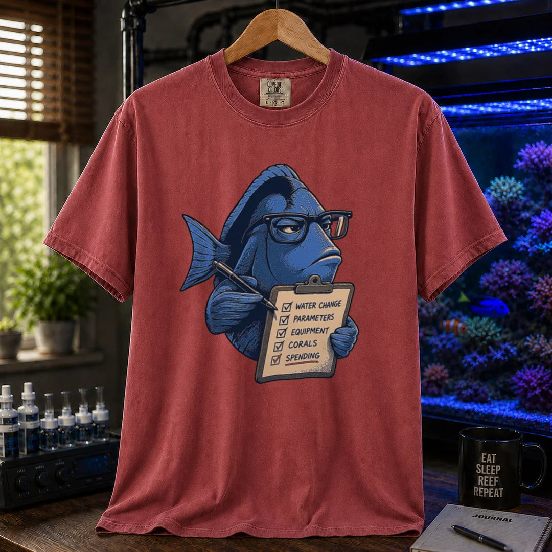 Saltwater aquarium graphic t-shirt featuring a blue tang with glasses holding a maintenance clipboard, maroon, red crew neck tee