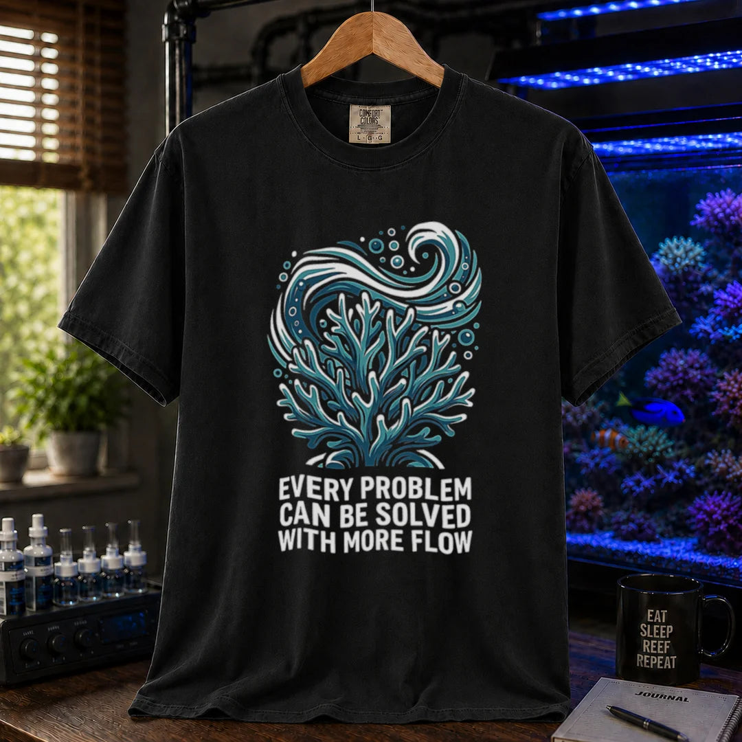 Saltwater aquarium graphic t-shirt featuring a swirling water current and coral illustration with text: EVERY PROBLEM CAN BE SOLVED WITH MORE FLOW, black crew neck tee
