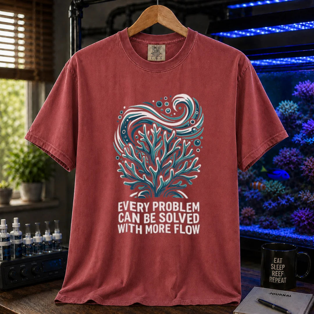 Saltwater aquarium graphic t-shirt featuring a swirling water current and coral illustration with text: EVERY PROBLEM CAN BE SOLVED WITH MORE FLOW, maroon, red crew neck tee