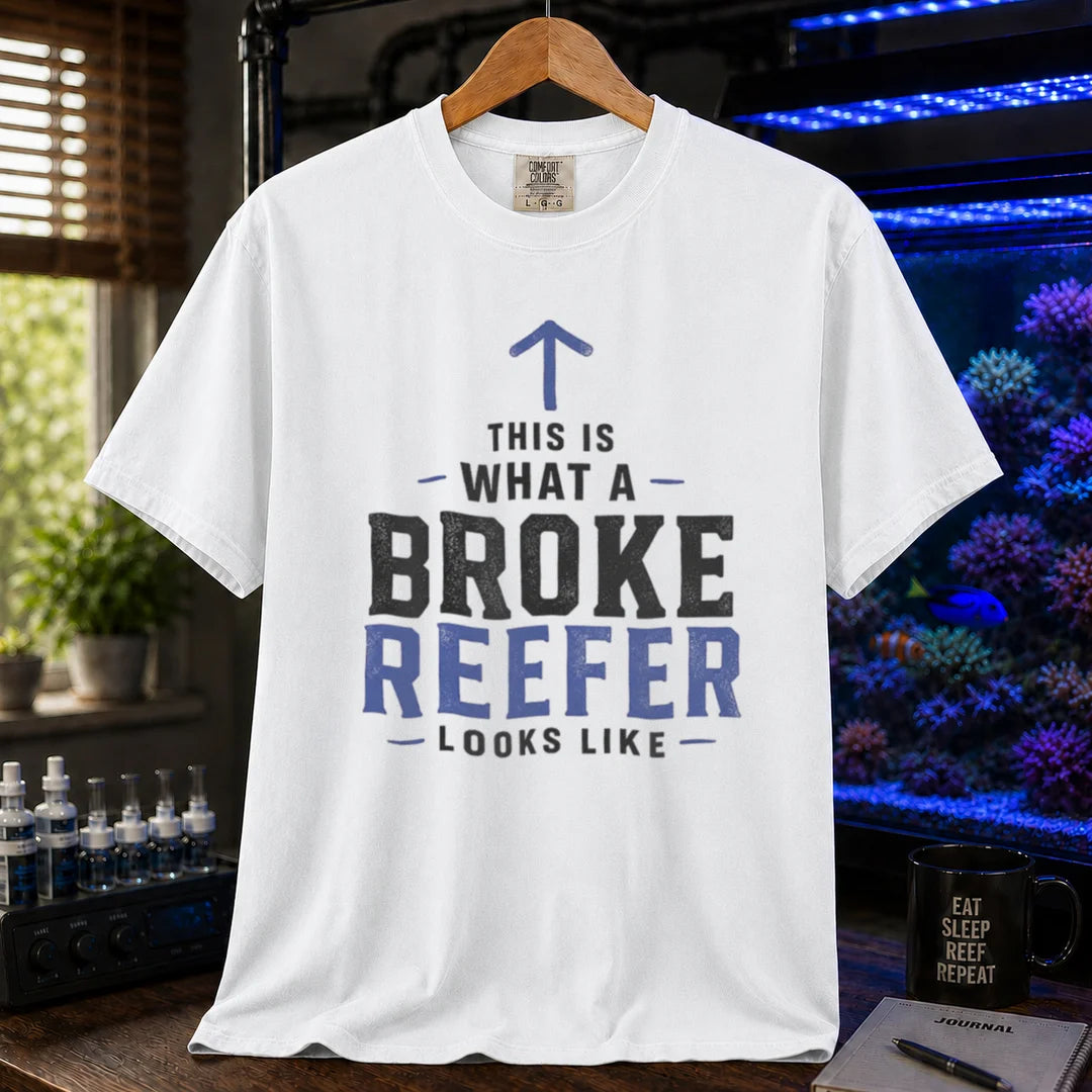 Saltwater aquarium graphic t-shirt featuring an upward arrow and bold text: THIS IS WHAT A BROKE REEFER LOOKS LIKE, white crew neck tee