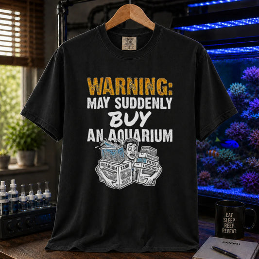 Saltwater aquarium graphic t-shirt featuring an illustration of a panicked person with tank boxes and text: WARNING: MAY SUDDENLY BUY AN AQUARIUM, black crew neck tee