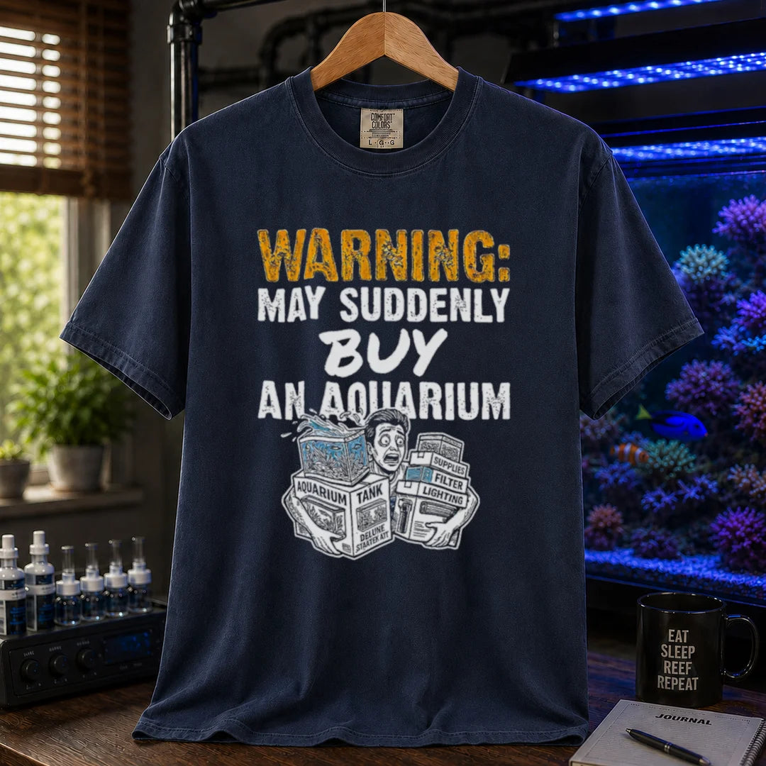 Saltwater aquarium graphic t-shirt featuring an illustration of a panicked person with tank boxes and text: WARNING: MAY SUDDENLY BUY AN AQUARIUM, navy crew neck tee