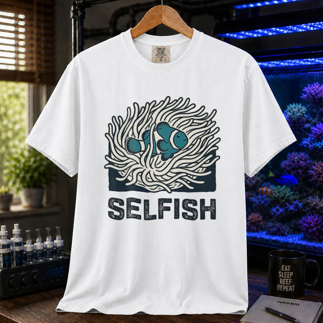 Saltwater aquarium graphic t-shirt featuring a clownfish in an anemone illustration and text: SELFISH, white crew neck tee