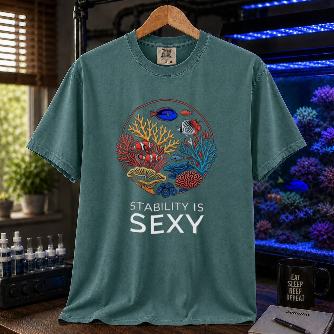 Saltwater aquarium graphic t-shirt featuring a circular coral reef illustration and text: STABILITY IS SEXY, green crew neck tee