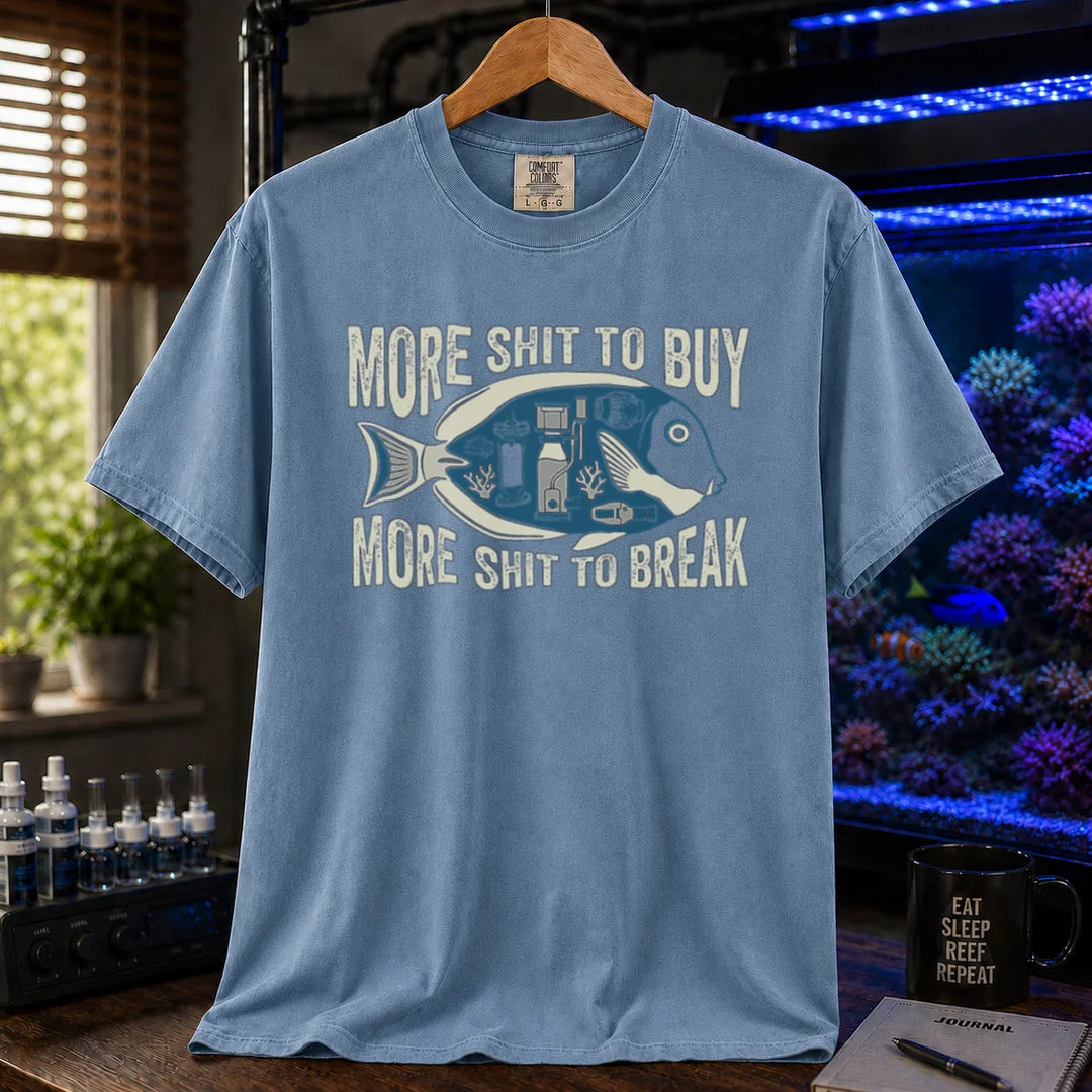 Saltwater aquarium graphic t-shirt featuring a fish silhouette with equipment and text: MORE SHIT TO BUY MORE SHIT TO BREAK, blue crew neck tee
