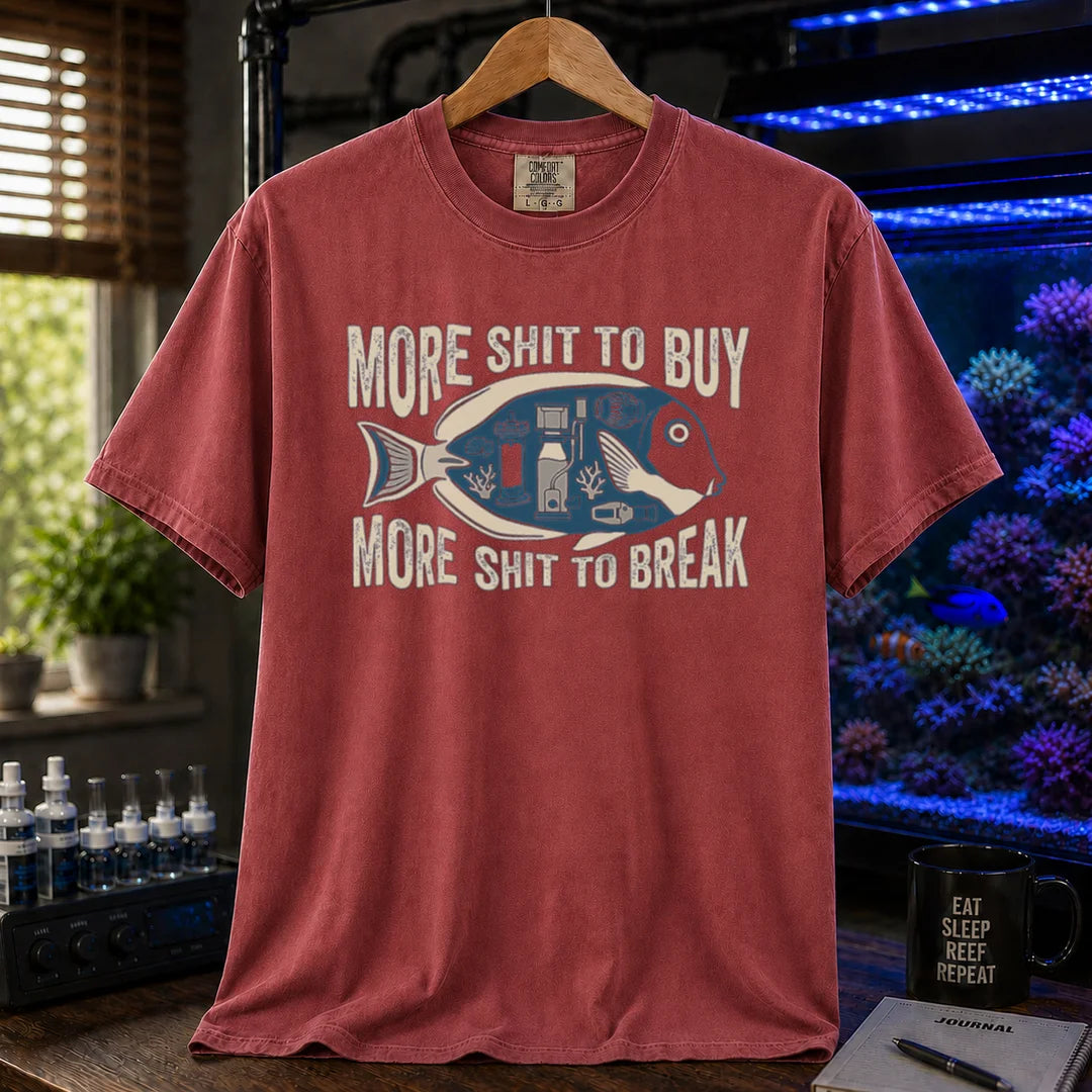 Saltwater aquarium graphic t-shirt featuring a fish silhouette with equipment and text: MORE SHIT TO BUY MORE SHIT TO BREAK, maroon, red crew neck tee