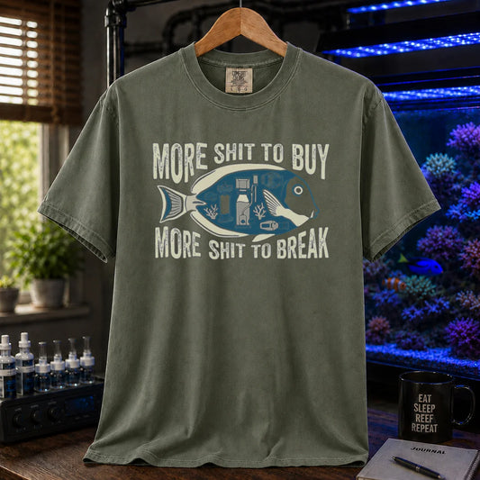 Saltwater aquarium graphic t-shirt featuring a fish silhouette with equipment and text: MORE SHIT TO BUY MORE SHIT TO BREAK, military green crew neck tee