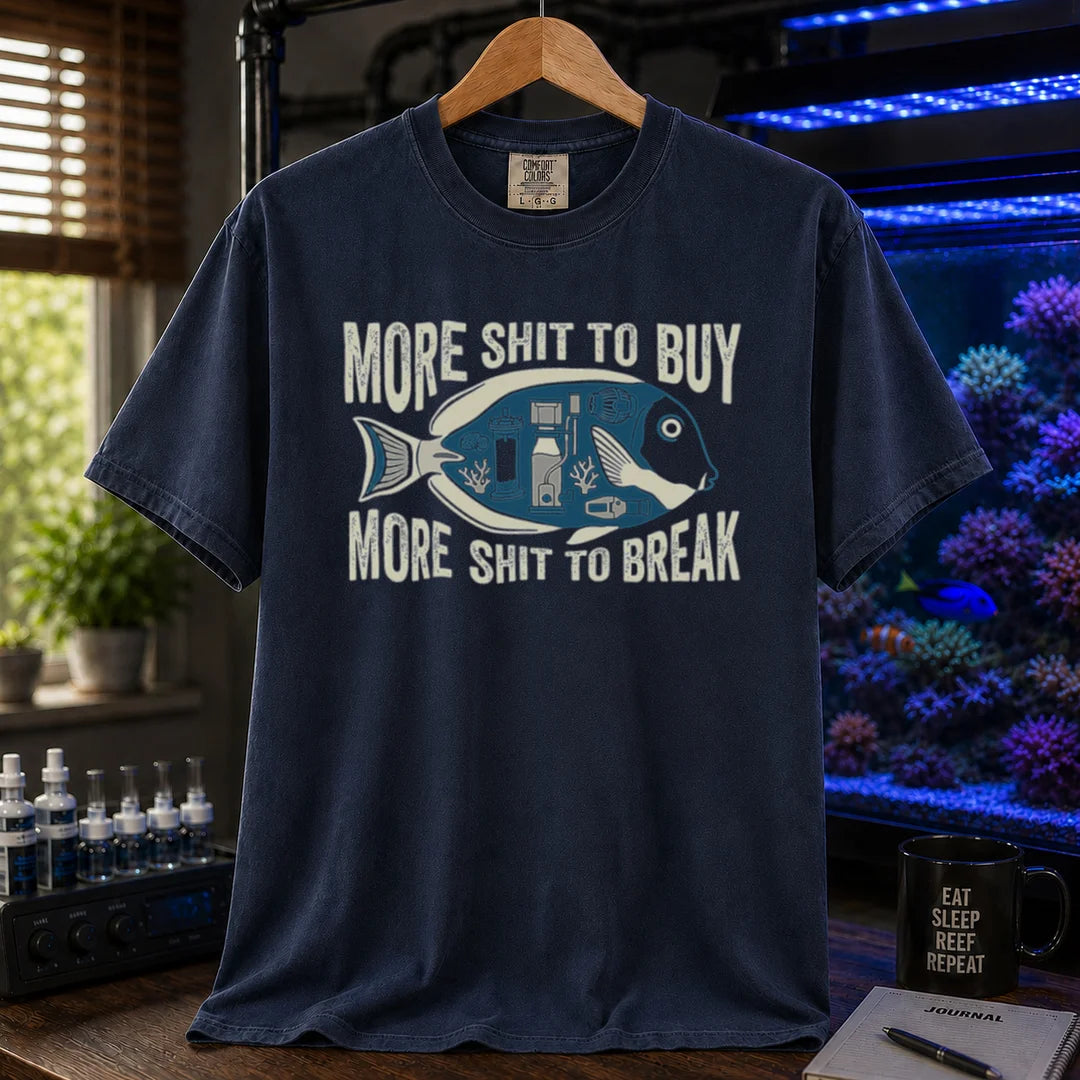 Saltwater aquarium graphic t-shirt featuring a fish silhouette with equipment and text: MORE SHIT TO BUY MORE SHIT TO BREAK, navy crew neck tee