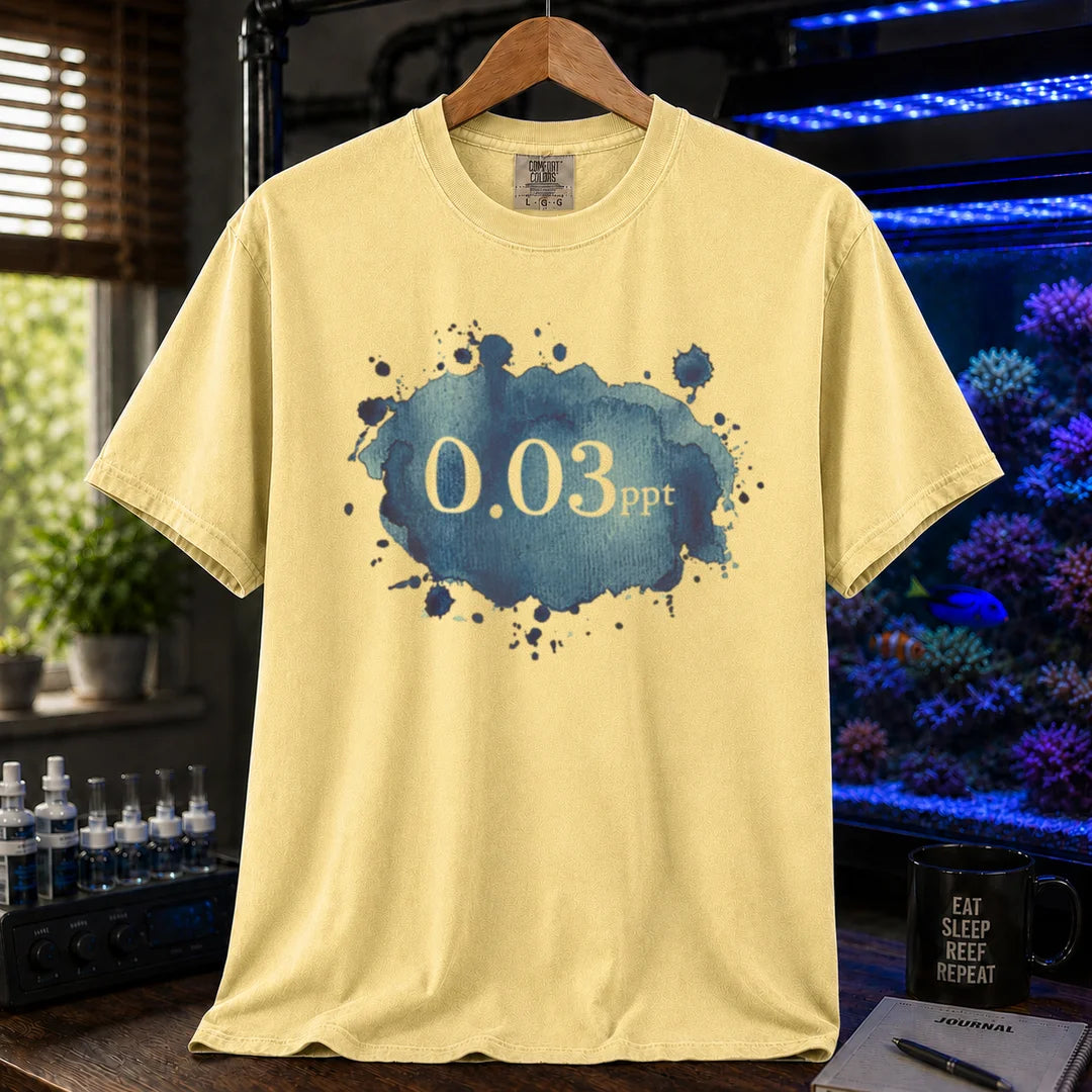 Saltwater aquarium graphic t-shirt featuring a blue watercolor splatter design and text: 0.03 ppt, yellow crew neck tee