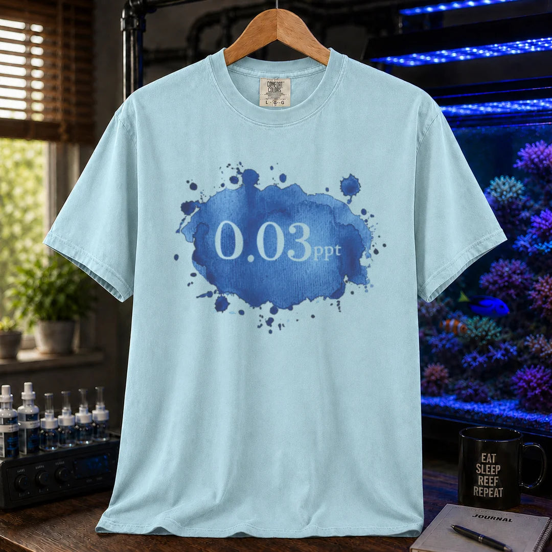 Saltwater aquarium graphic t-shirt featuring a blue watercolor splatter design and text: 0.03 ppt, light blue crew neck tee