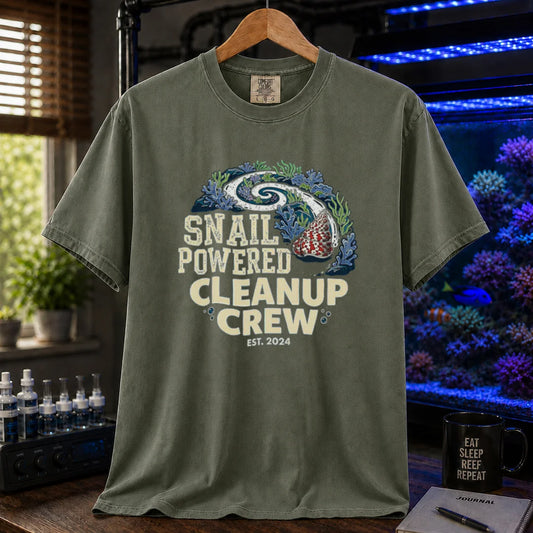 Saltwater aquarium graphic t-shirt featuring a snail leaving a clean trail through a reef with text: SNAIL POWERED CLEANUP CREW EST. 2024, military green crew neck tee