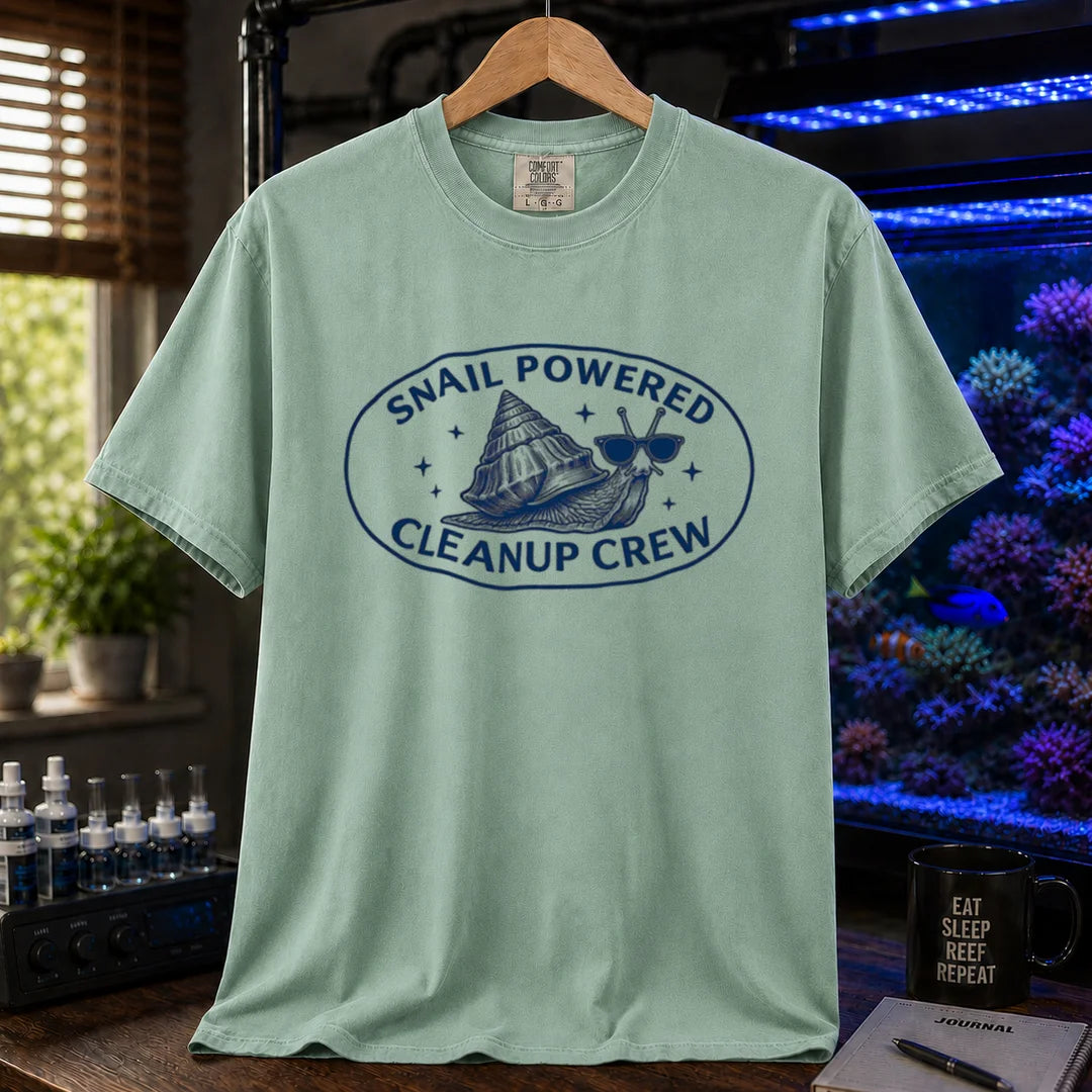 Saltwater aquarium graphic t-shirt featuring an oval emblem of a snail in sunglasses and text: SNAIL POWERED CLEANUP CREW, green crew neck tee