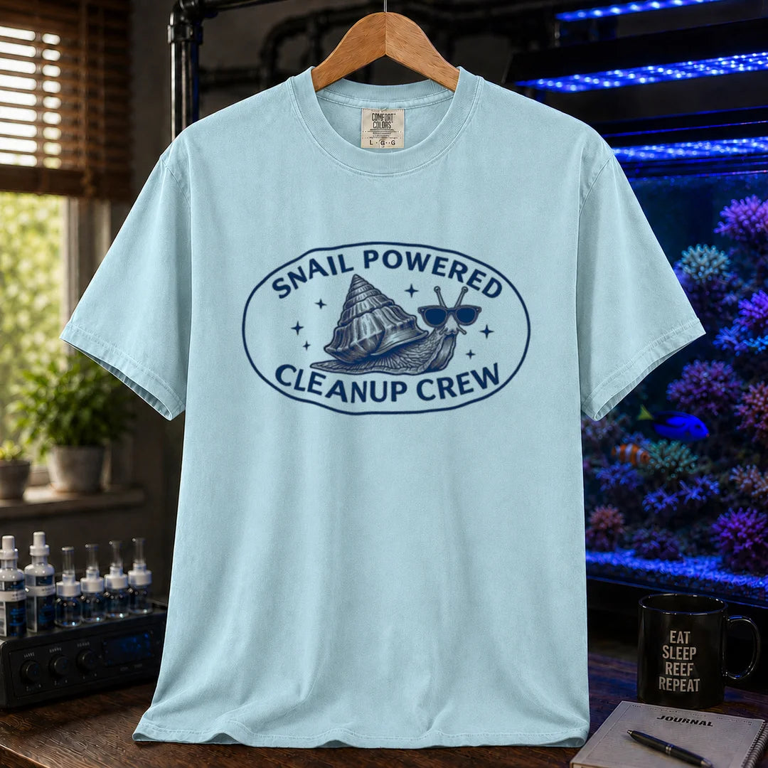 Saltwater aquarium graphic t-shirt featuring an oval emblem of a snail in sunglasses and text: SNAIL POWERED CLEANUP CREW, light blue crew neck tee