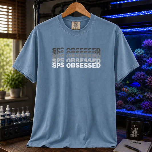 Saltwater aquarium graphic t-shirt featuring stacked retro fading text: SPS OBSESSED, blue crew neck tee