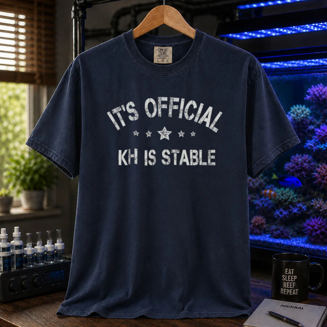 Saltwater aquarium graphic t-shirt featuring stars and distressed text: IT'S OFFICIAL KH IS STABLE, navy crew neck tee