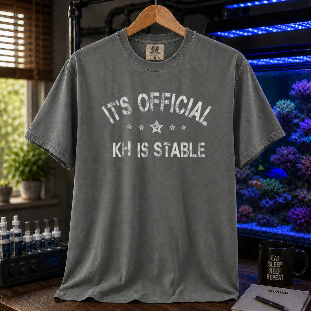 Saltwater aquarium graphic t-shirt featuring stars and distressed text: IT'S OFFICIAL KH IS STABLE, dark grey crew neck tee