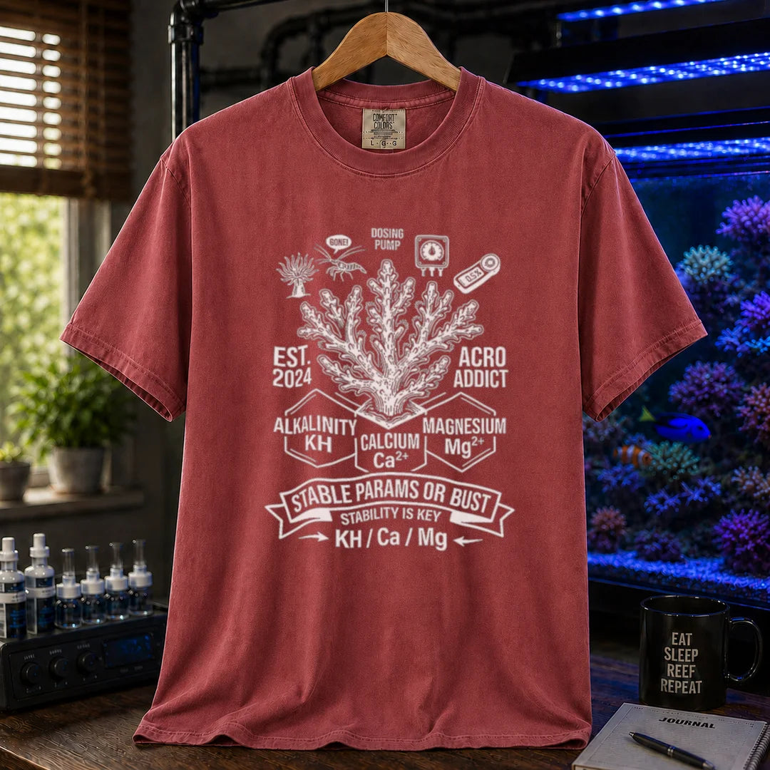 Saltwater aquarium graphic t-shirt featuring a coral center, parameter blocks, and text: STABLE PARAMS OR BUST STABILITY IS KEY KH / Ca / Mg, maroon, red crew neck tee