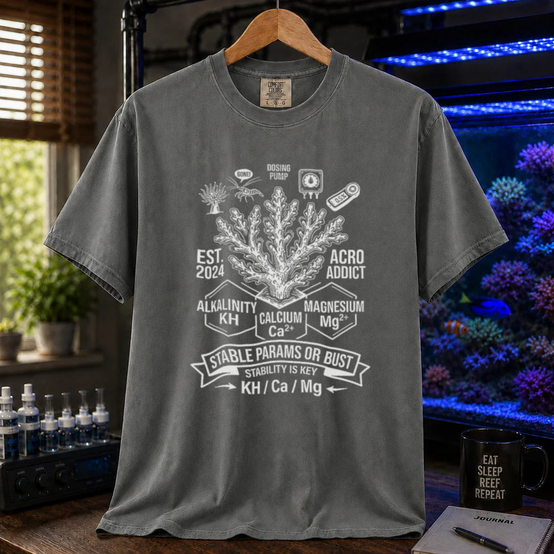 Saltwater aquarium graphic t-shirt featuring a coral center, parameter blocks, and text: STABLE PARAMS OR BUST STABILITY IS KEY KH / Ca / Mg, dark grey crew neck tee