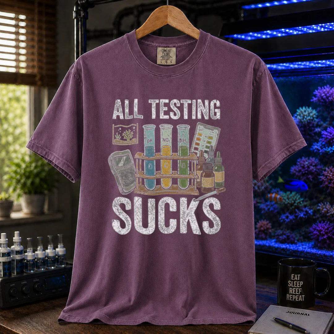Saltwater aquarium graphic t-shirt featuring test tubes, reagent bottles, and text: ALL TESTING SUCKS, purple crew neck tee