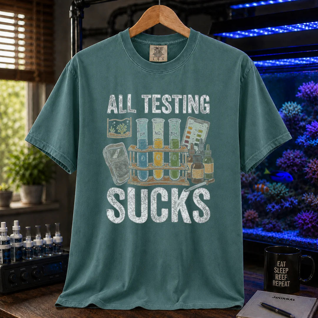 Saltwater aquarium graphic t-shirt featuring test tubes, reagent bottles, and text: ALL TESTING SUCKS, green crew neck tee