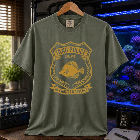 Saltwater aquarium graphic t-shirt featuring a gold police badge with a tang fish and text: TANG POLICE DEPT. TO PROTECT & OBSERVE, military green crew neck tee