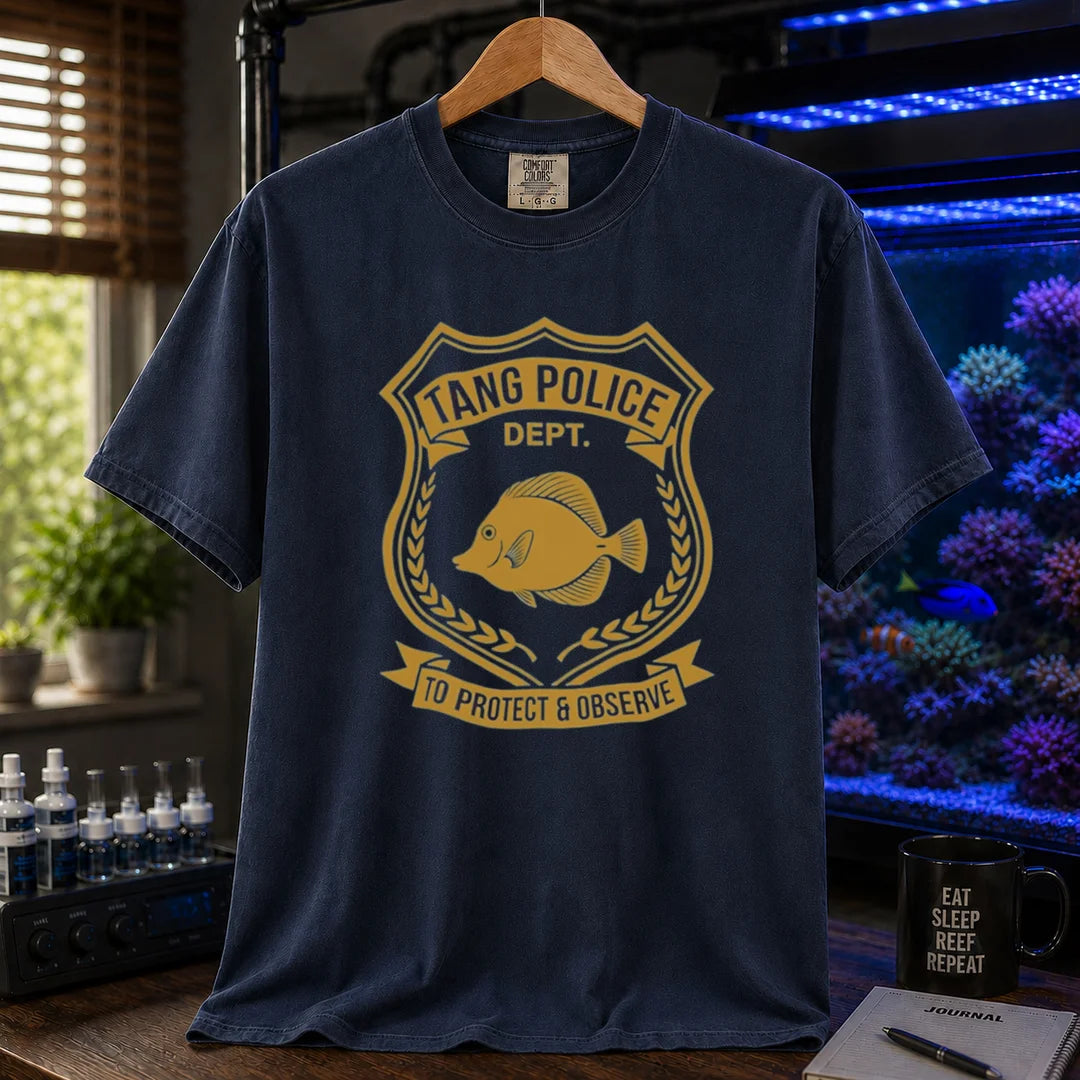 Saltwater aquarium graphic t-shirt featuring a gold police badge with a tang fish and text: TANG POLICE DEPT. TO PROTECT & OBSERVE, navy crew neck tee