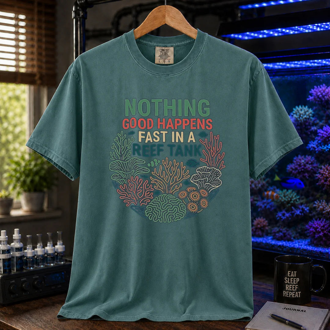 Saltwater aquarium graphic t-shirt featuring a circular coral wreath illustration and colorful text: NOTHING GOOD HAPPENS FAST IN A REEF TANK, green crew neck tee