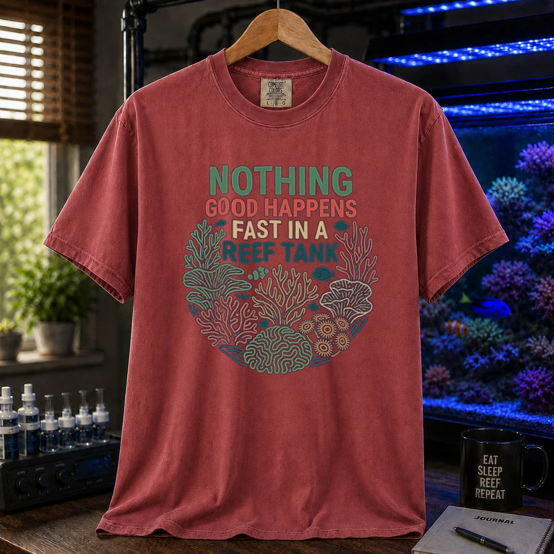 Saltwater aquarium graphic t-shirt featuring a circular coral wreath illustration and colorful text: NOTHING GOOD HAPPENS FAST IN A REEF TANK, maroon, red crew neck tee