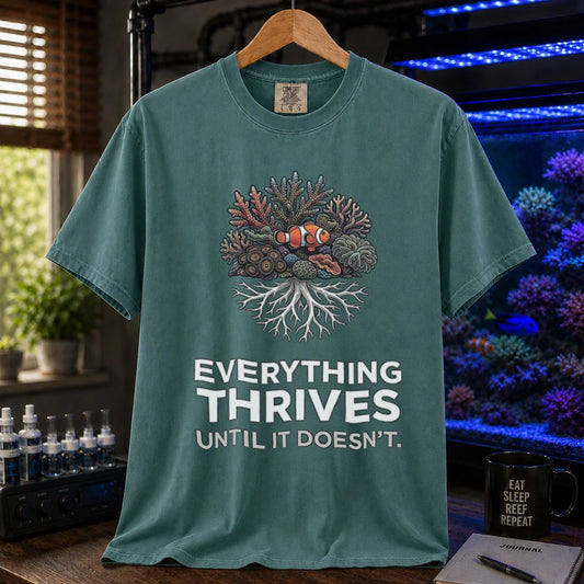 Saltwater aquarium graphic t-shirt featuring a coral reef cluster with a clownfish and text: EVERYTHING THRIVES UNTIL IT DOESN'T., green crew neck tee
