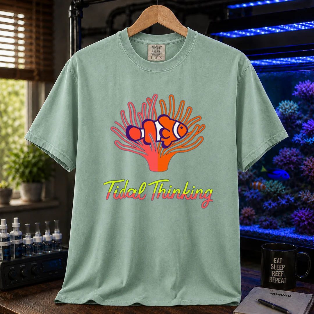 Saltwater aquarium graphic t-shirt featuring a clownfish in an anemone and cursive text: Tidal Thinking, green crew neck tee