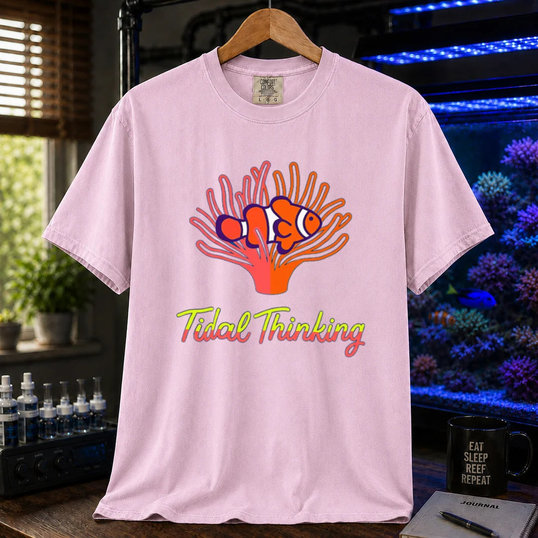 Saltwater aquarium graphic t-shirt featuring a clownfish in an anemone and cursive text: Tidal Thinking, pink crew neck tee