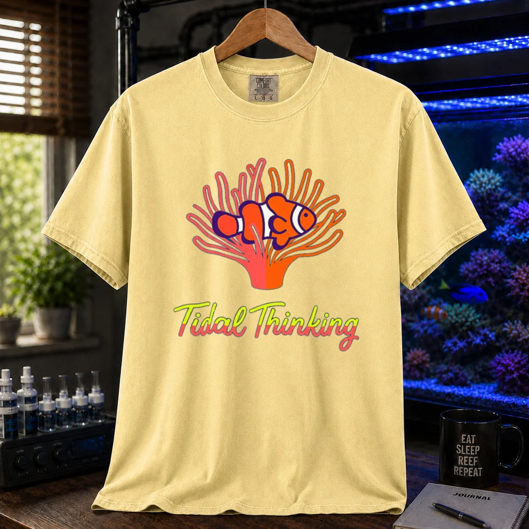 Saltwater aquarium graphic t-shirt featuring a clownfish in an anemone and cursive text: Tidal Thinking, yellow crew neck tee