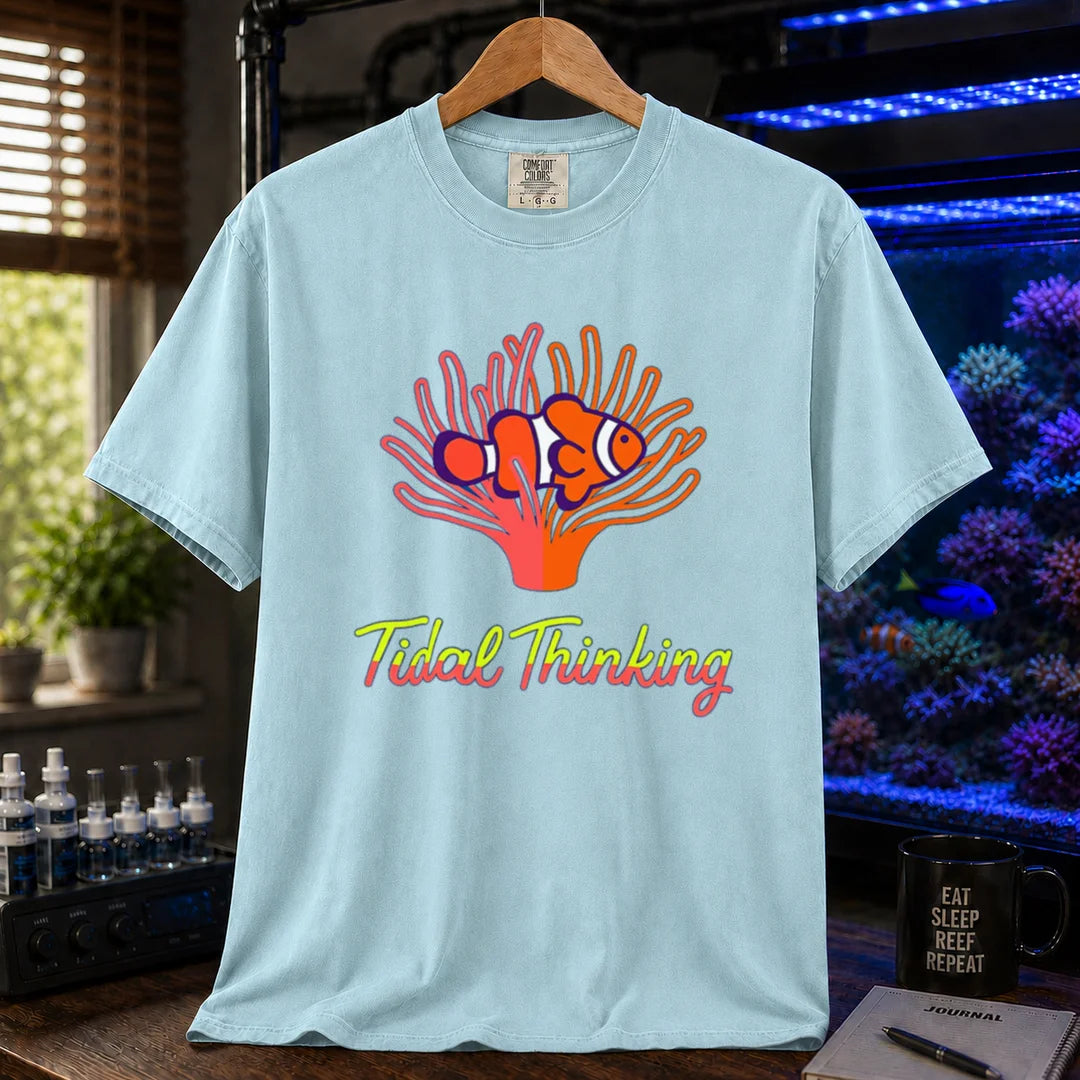 Saltwater aquarium graphic t-shirt featuring a clownfish in an anemone and cursive text: Tidal Thinking, light blue crew neck tee