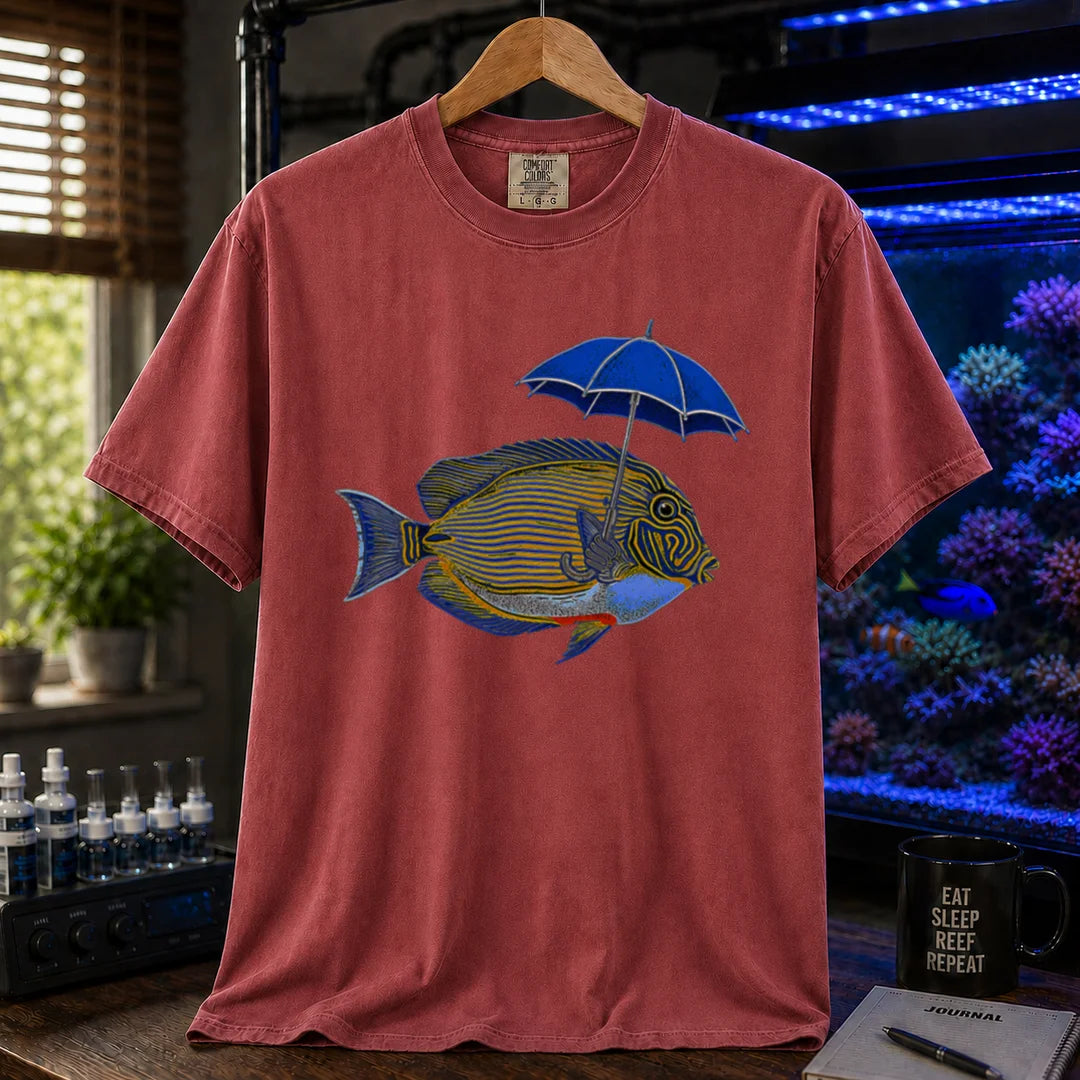 Saltwater aquarium graphic t-shirt featuring a lined tang fish holding a blue umbrella, maroon, red crew neck tee