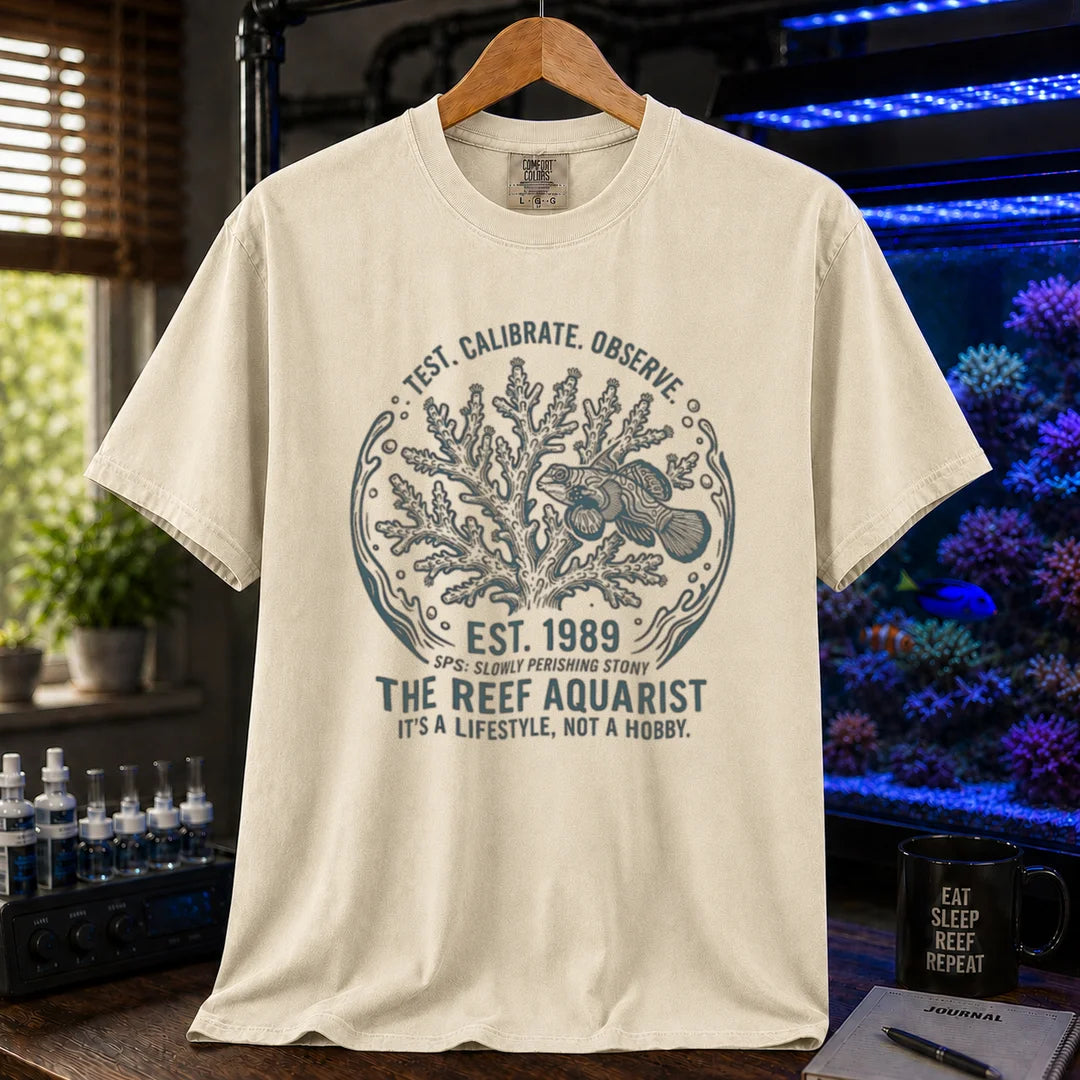 Saltwater aquarium graphic t-shirt featuring a circular coral and fish badge with text: TEST. CALIBRATE. OBSERVE. EST. 1989 THE REEF AQUARIST IT'S A LIFESTYLE, NOT A HOBBY., cream, beige, ivory crew neck tee