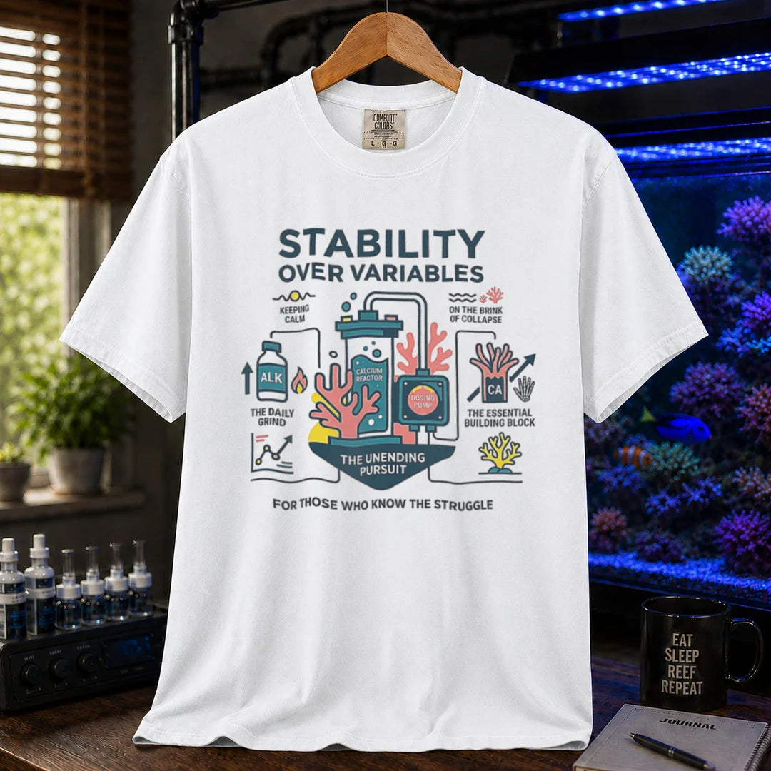 Saltwater aquarium graphic t-shirt featuring a detailed technical diagram with coral and text: STABILITY OVER VARIABLES FOR THOSE WHO KNOW THE STRUGGLE, white crew neck tee