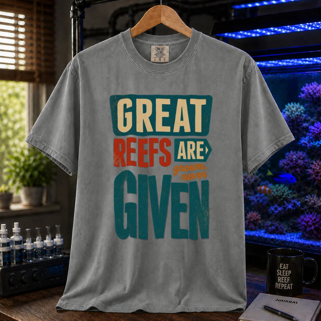Saltwater aquarium graphic t-shirt featuring bold block text: GREAT REEFS ARE GROWN, NEVER GIVEN, grey crew neck tee