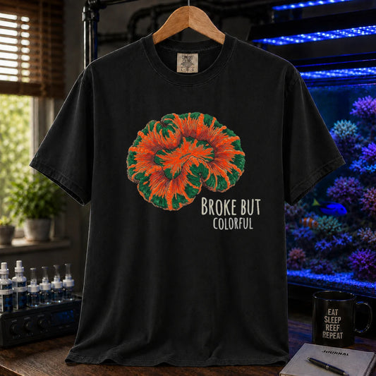 Saltwater aquarium graphic t-shirt featuring an illustration of a brightly colored Scolymia coral and text reading Broke But Colorful, black crew neck tee