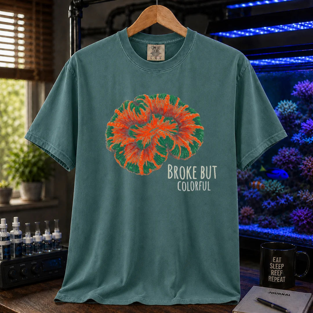 Saltwater aquarium graphic t-shirt featuring an illustration of a brightly colored Scolymia coral and text reading Broke But Colorful, green crew neck tee