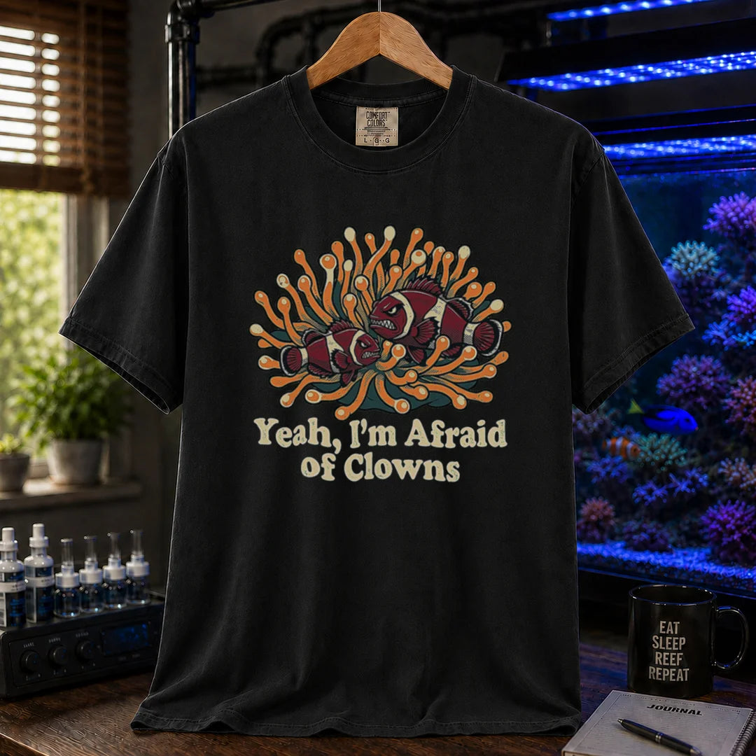 Saltwater aquarium graphic t-shirt featuring an illustration of angry clownfish in an anemone with text reading Yeah, I'm Afraid of Clowns, black crew neck tee