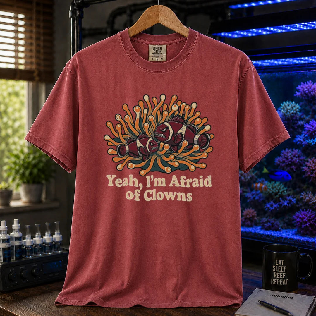 Saltwater aquarium graphic t-shirt featuring an illustration of angry clownfish in an anemone with text reading Yeah, I'm Afraid of Clowns, maroon, red crew neck tee