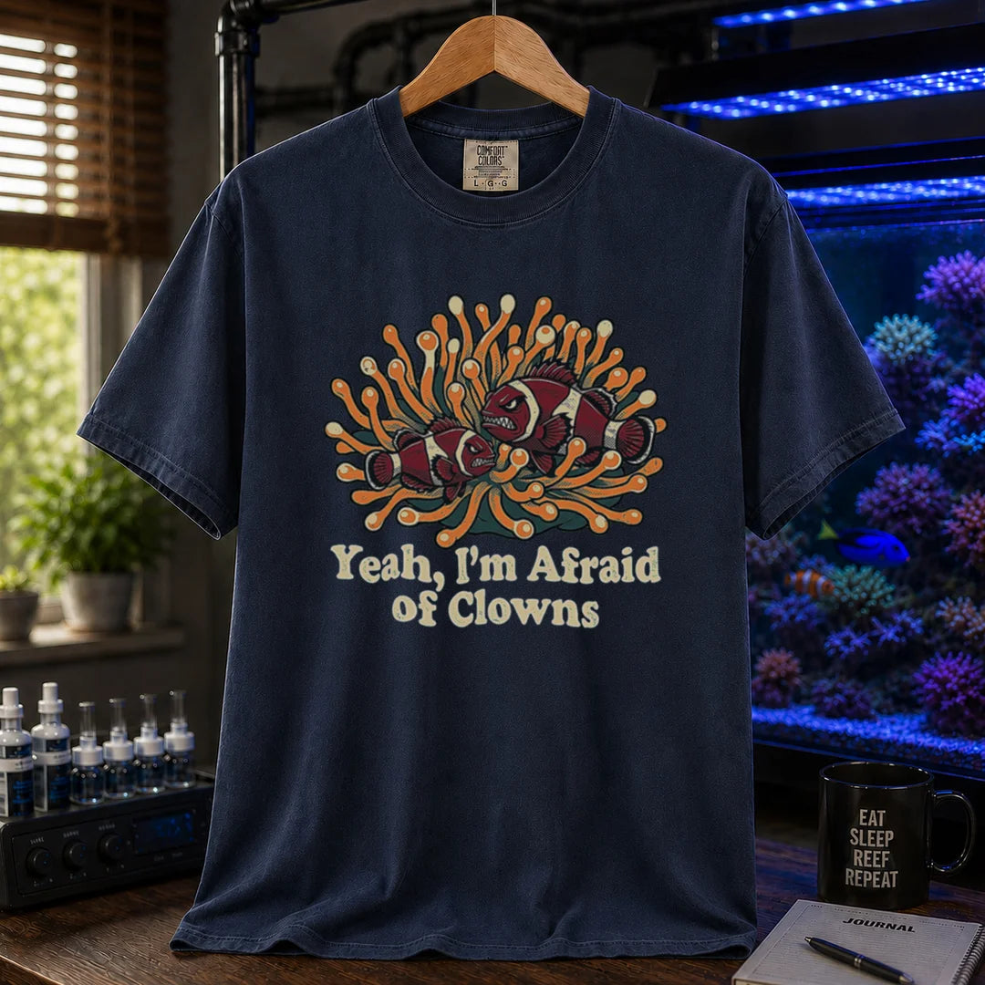 Saltwater aquarium graphic t-shirt featuring an illustration of angry clownfish in an anemone with text reading Yeah, I'm Afraid of Clowns, navy crew neck tee