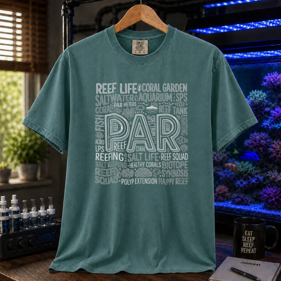Saltwater aquarium graphic t-shirt featuring a typography collage centered around the word PAR with reef terminology on a green crew neck tee