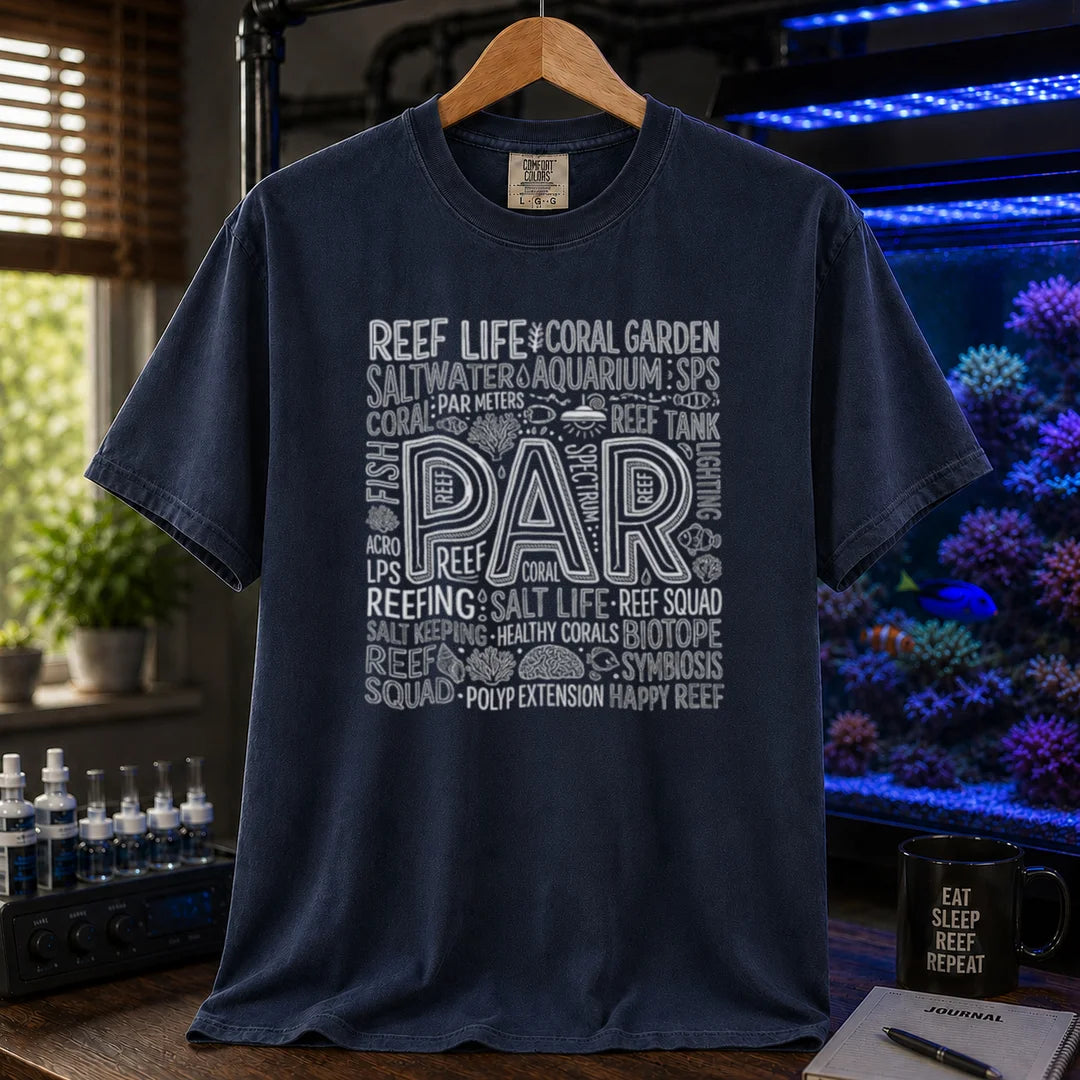 Saltwater aquarium graphic t-shirt featuring a typography collage centered around the word PAR with reef terminology on a navy crew neck tee