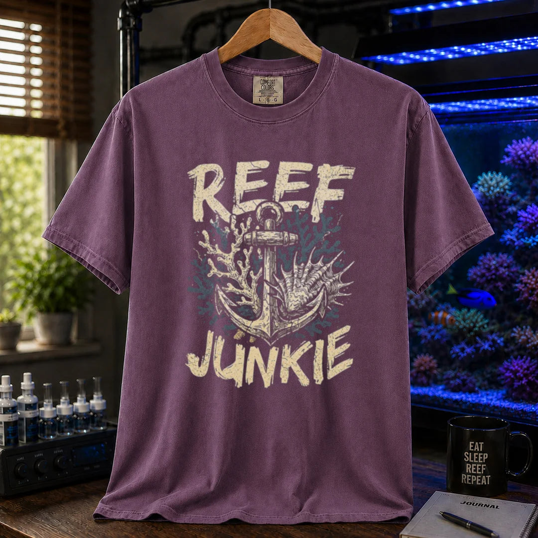 Saltwater aquarium graphic t-shirt featuring an anchor tangled in coral and shells with the text REEF JUNKIE,  purple crew neck tee