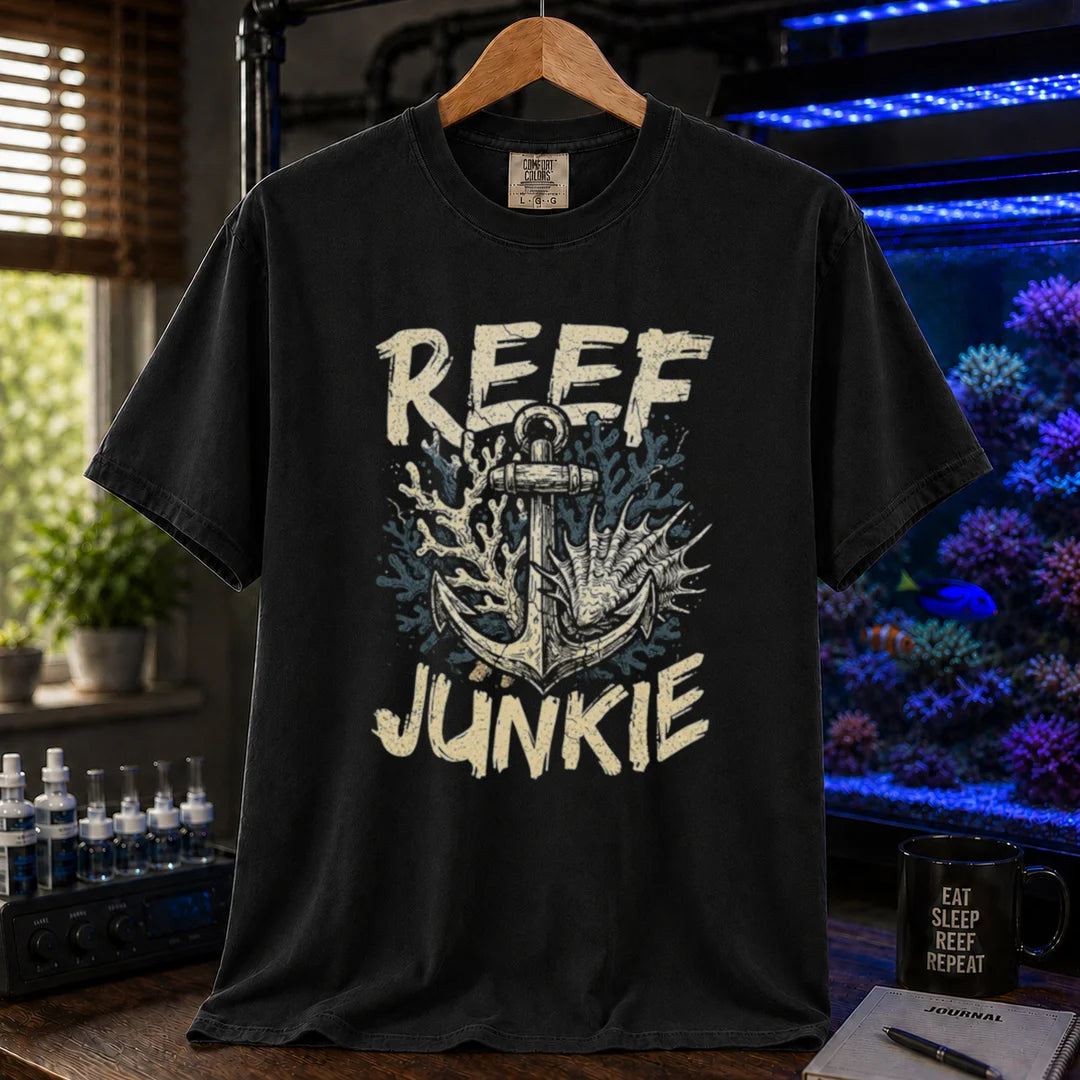 Saltwater aquarium graphic t-shirt featuring an anchor tangled in coral and shells with the text REEF JUNKIE,  black crew neck tee