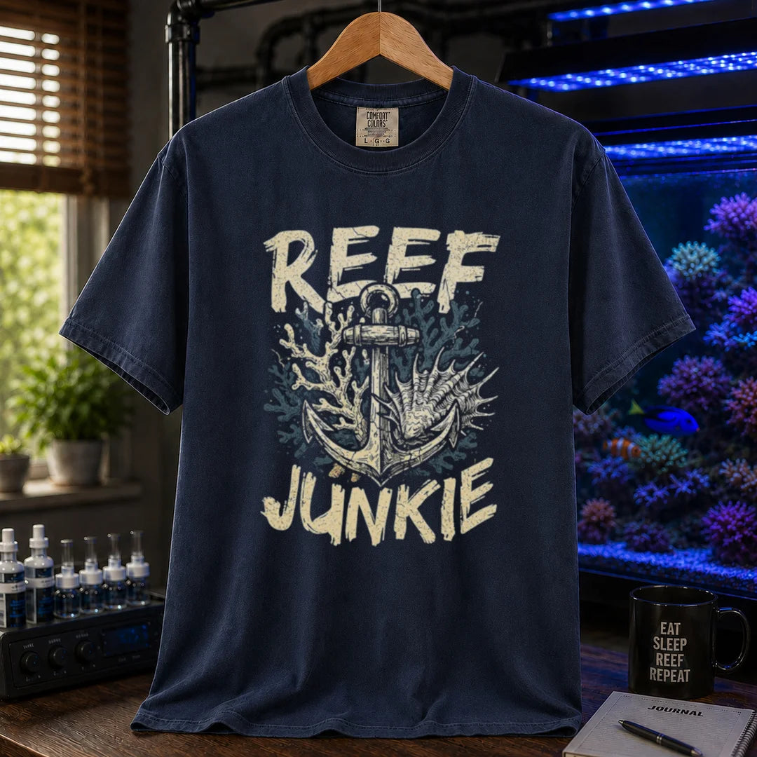 Saltwater aquarium graphic t-shirt featuring an anchor tangled in coral and shells with the text REEF JUNKIE, navy crew neck tee